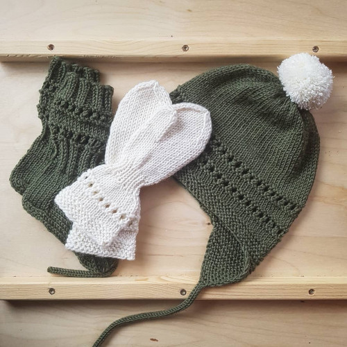 set of olive socks, white mittens and an olive beanie